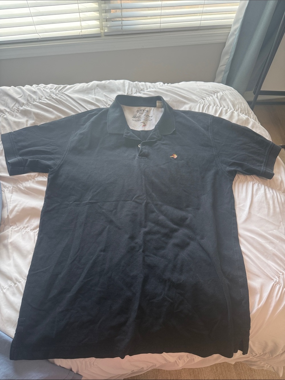 Orvis Men’s Black Polo with Embroidered Fish Logo